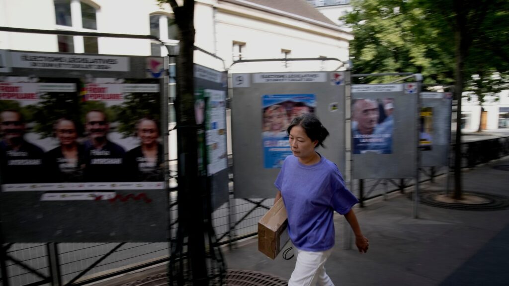 The Latest | Polls are open in France's early legislative election