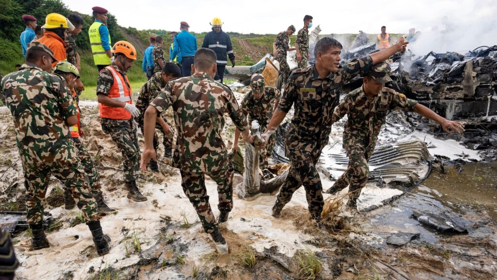 A plane with 19 people on board slips off the runway and crashes at Nepal airport