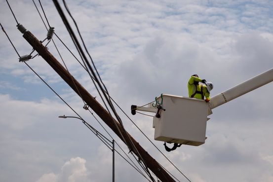 The Rush to Shore Up the Power Grid Against Hurricanes, Heat and Hail