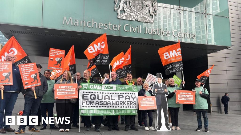 Asda workers hold rally as equal pay case begins in Manchester