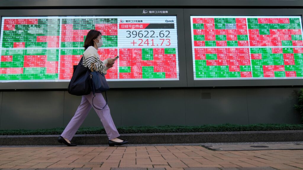 Global stocks mixed after Wall Street declines; markets wait for China policy briefing