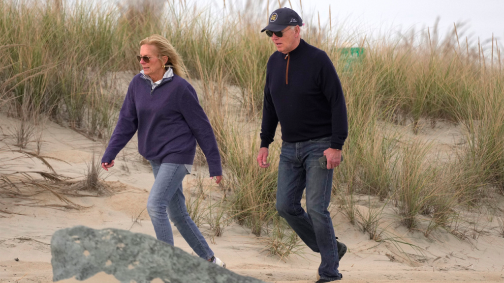 Biden appears to struggle while walking on Delaware beach with first lady