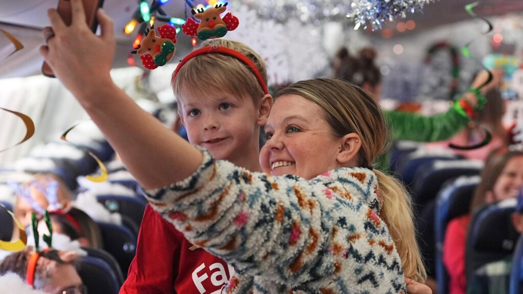 Flight takes kids to visit Santa at North Pole scene in transformed Denver airport hangar