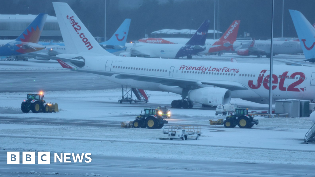 Flights and trains cancelled as snow hits UK