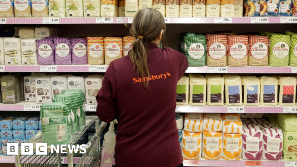 Sainsbury's raises pay but is cautious on hiring