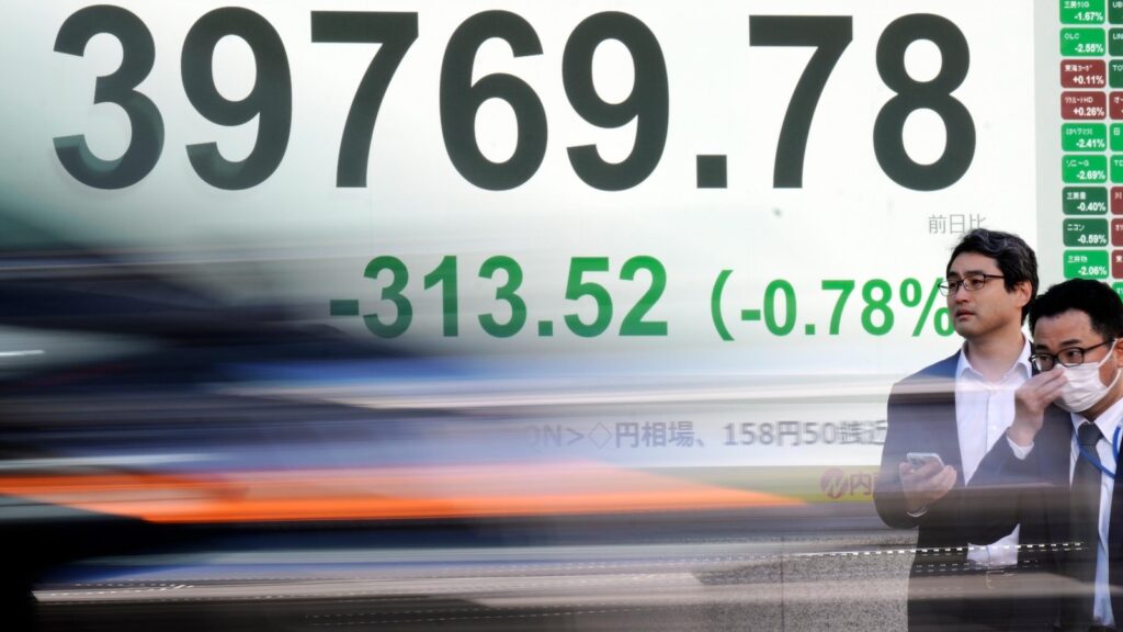 Stock market today: Asian shares slip after Wall St slumps despite strong US economic data